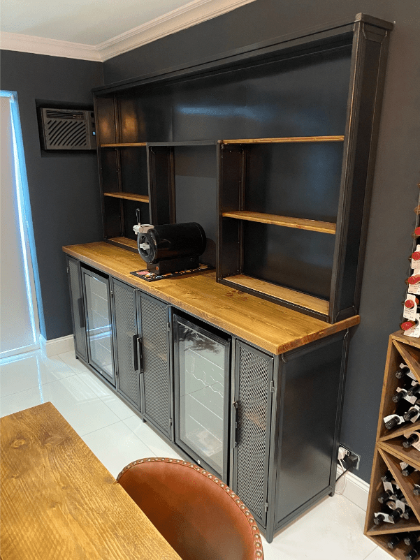 Industrial Furniture: Raw and rustic dining table with exposed metal legs and distressed wooden top.