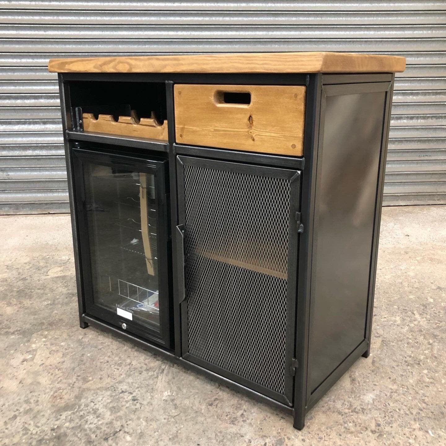 Industrial wine cabinet sideboard with built-in fridge and rustic wood countertop
