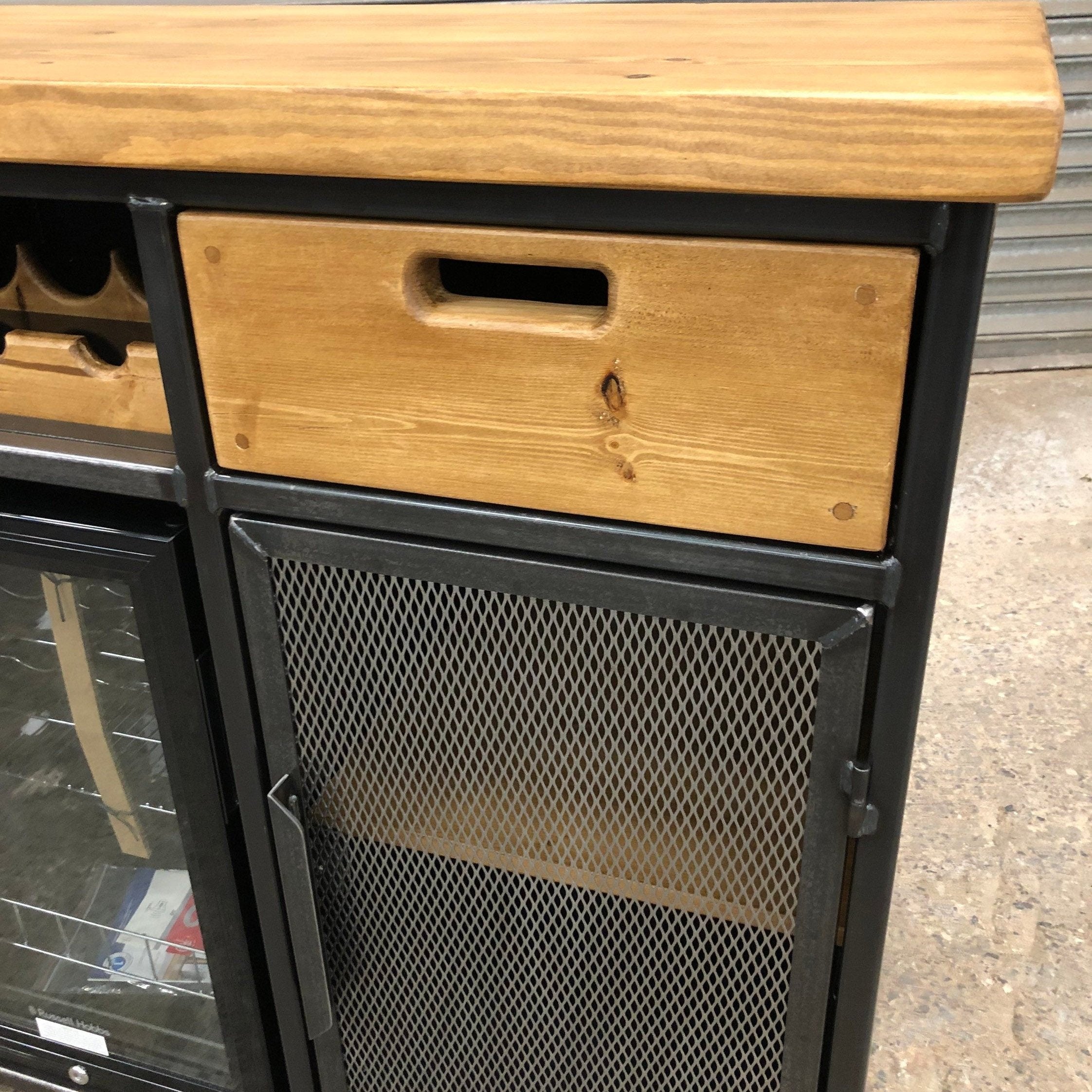 Rustic wood and steel wine cabinet with wine bottle rack
