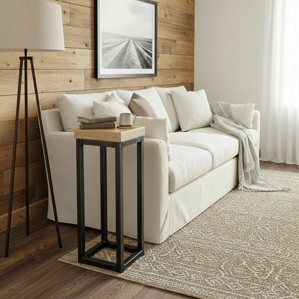 Living room with a white sofa, wooden side table, and framed picture on a wooden wall.