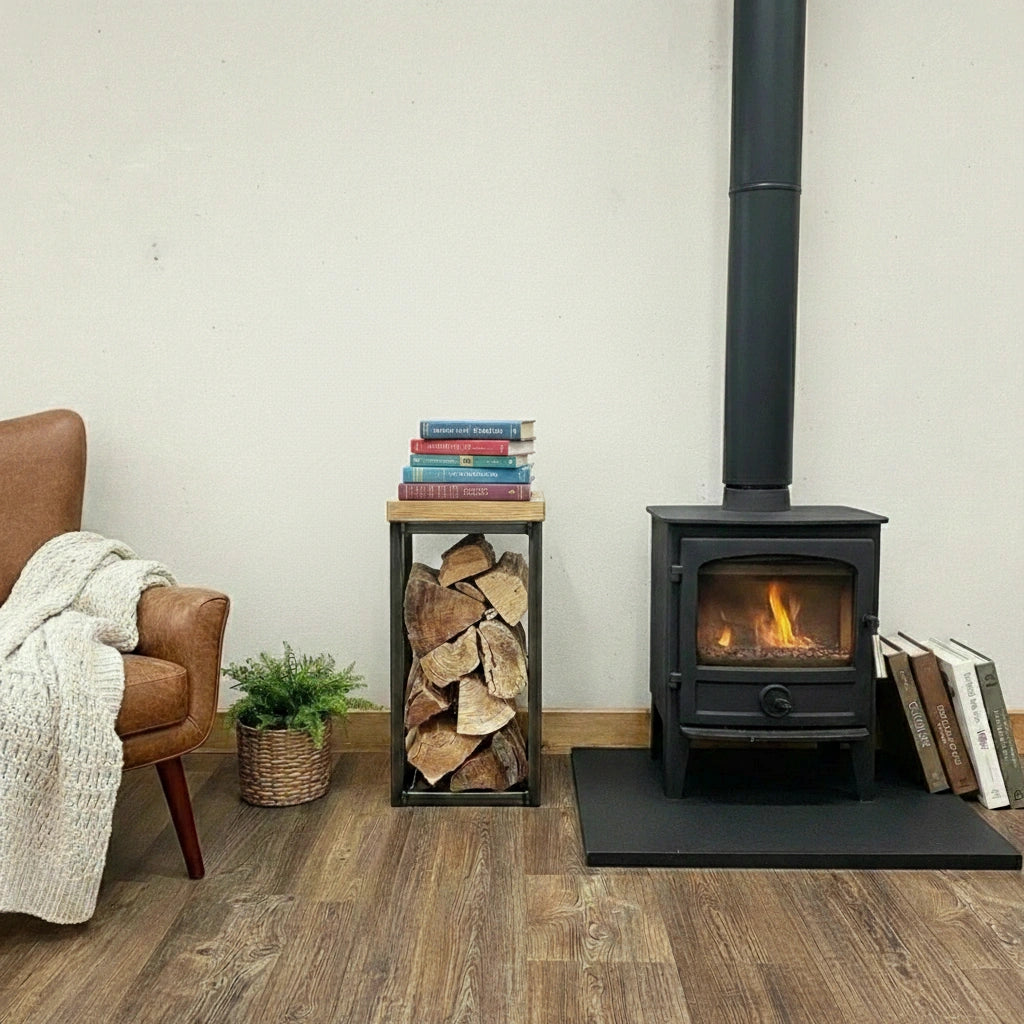 Wood-burning stove in a room with a chair, books, and firewood.