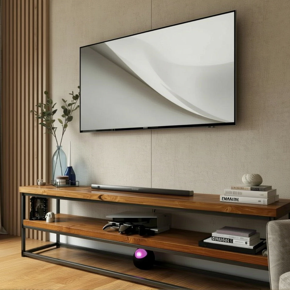 Wooden TV stand with a television mounted on the wall in a living room setting.